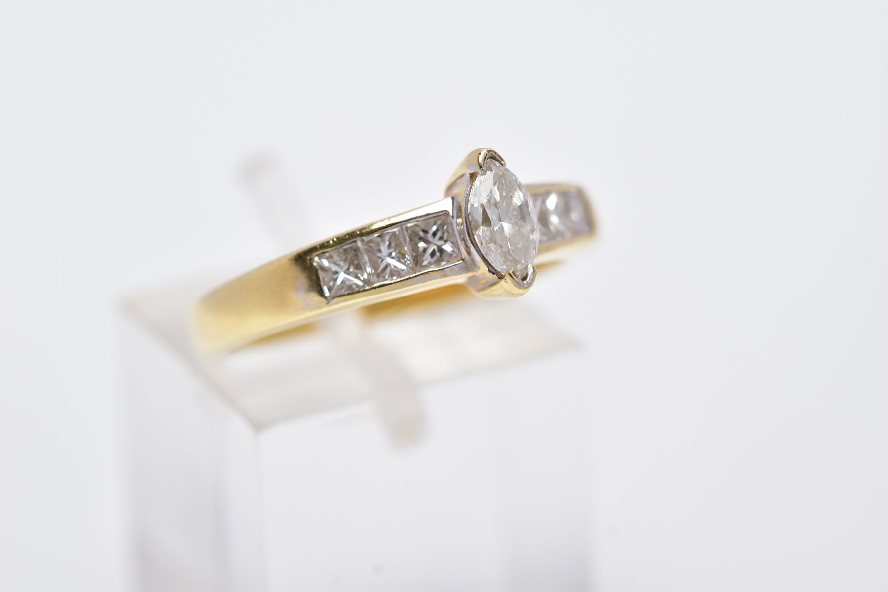 A YELLOW METAL DIAMOND RING, designed with a central raised, marquise cut diamond, flanked with - Image 4 of 4