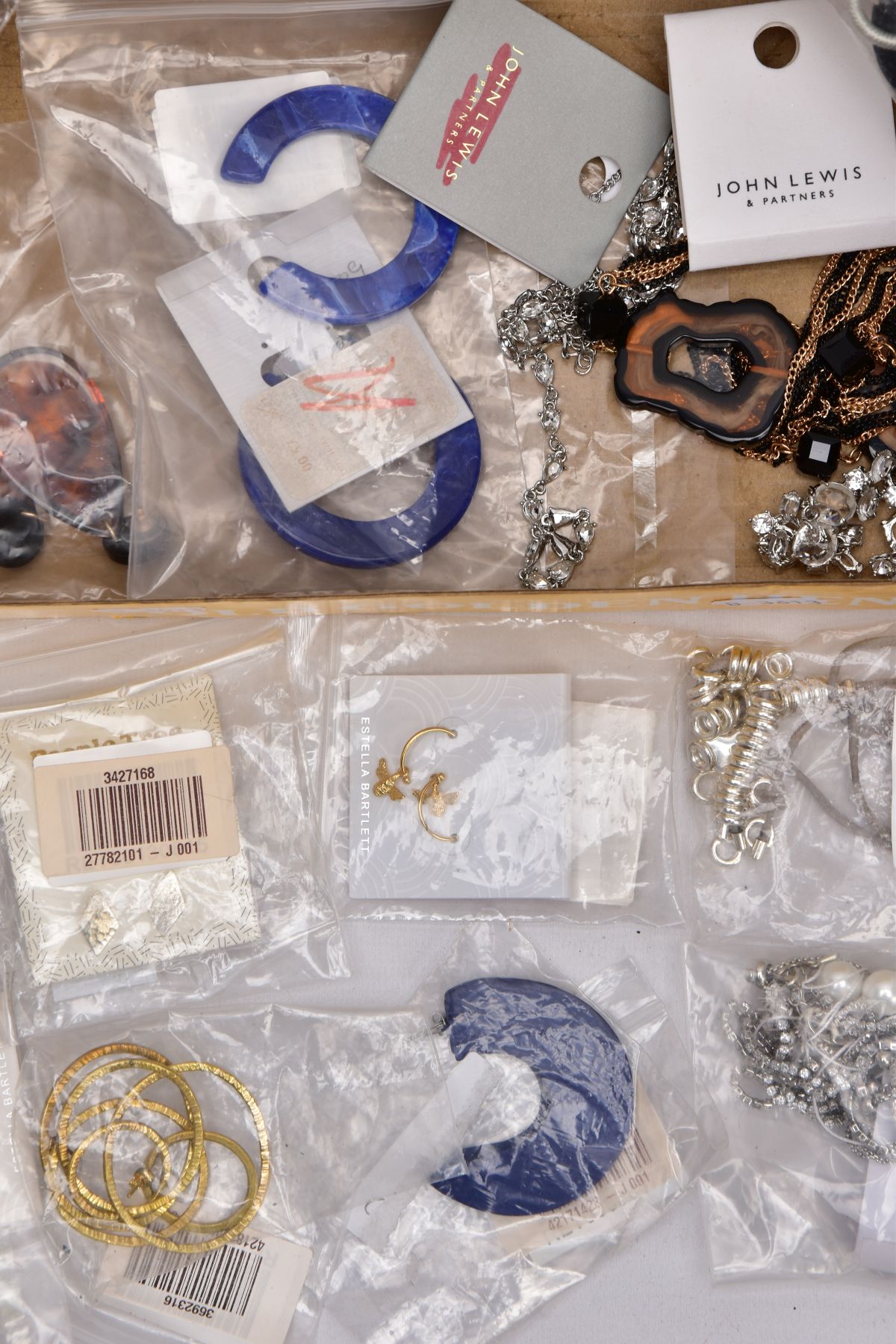 A TRAY OF COSTUME JEWELLERY, some pieces with tags and packaging, to include a large resin hoop - Image 3 of 4