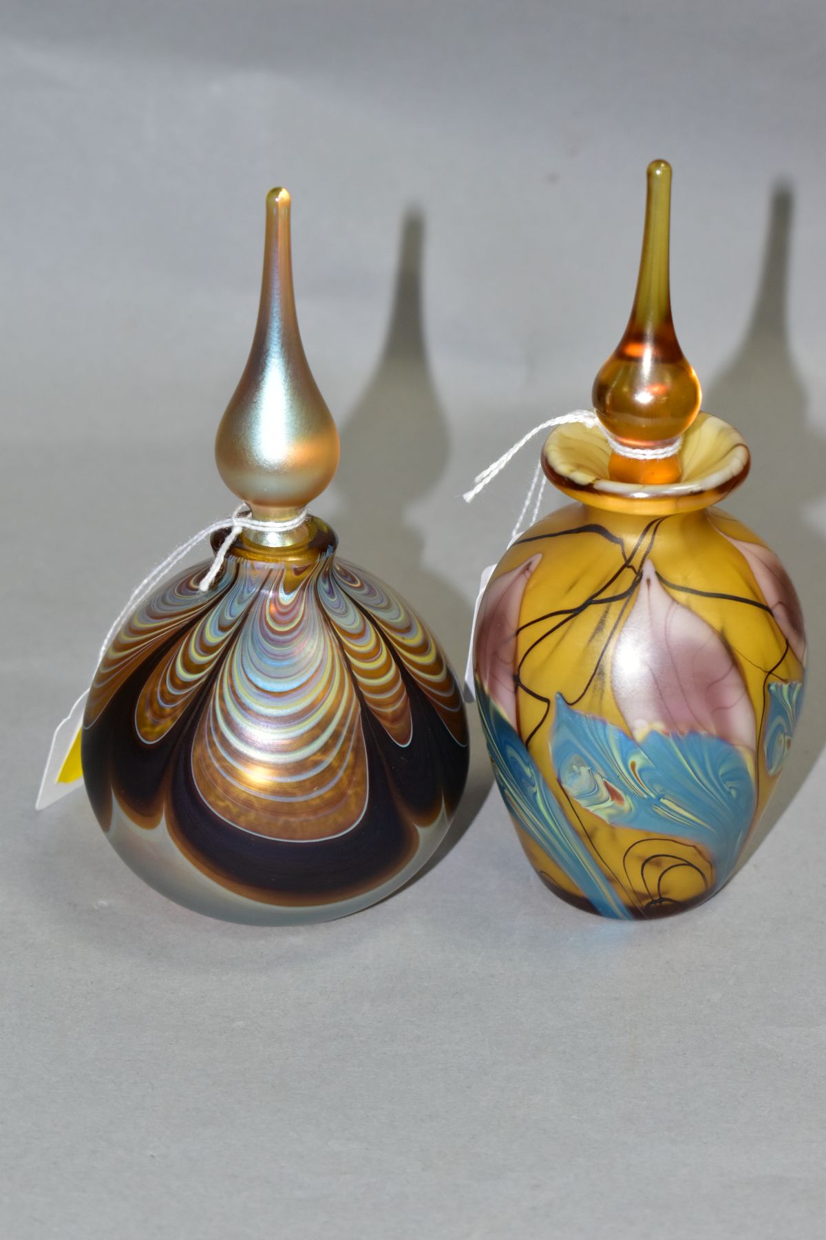 TWO IRIDESCENT PERFUME BOTTLES AND STOPPERS, one of baluster form, height 16cm, the other of bulbous - Image 3 of 5