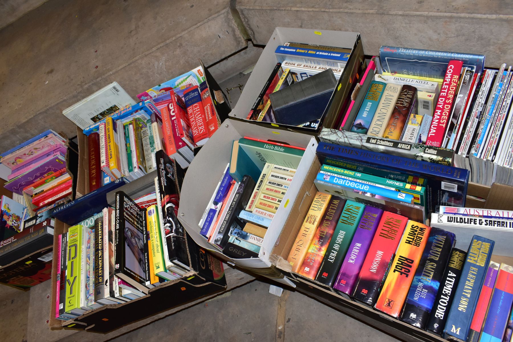 SEVEN BOXES OF ASSORTED BOOKS, including novels, cookery books, DIY books, motoring interest etc,