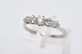 AN EARLY 20TH CENTURY FIVE STONE DIAMOND RING, designed with five claw set, graduated old cut