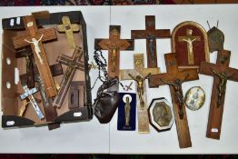 A BOX OF VARIOUS CRUCIFIXES, some metal, mostly resin, mostly wall hangings, tallest height 36cm,