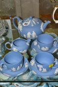 A SMALL COLLECTION OF WEDGWOOD PALE BLUE JASPERWARE, comprising a tea pot and cover and flattened