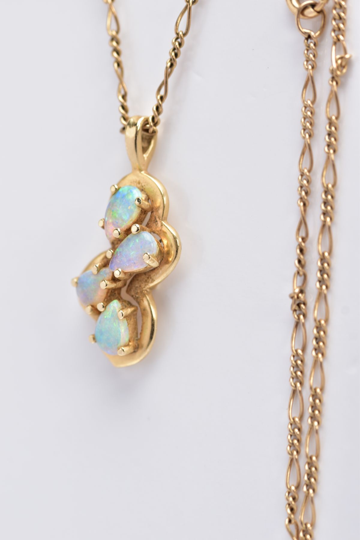 A MODERN FOUR STONE OPAL PENDANT, pendant stamped '14k', together with a Figaro link chain, - Image 3 of 3