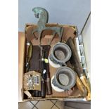 A BOX OF METALWARES, including four vintage meat cleavers, a Victorian ham hock brace, a pair of