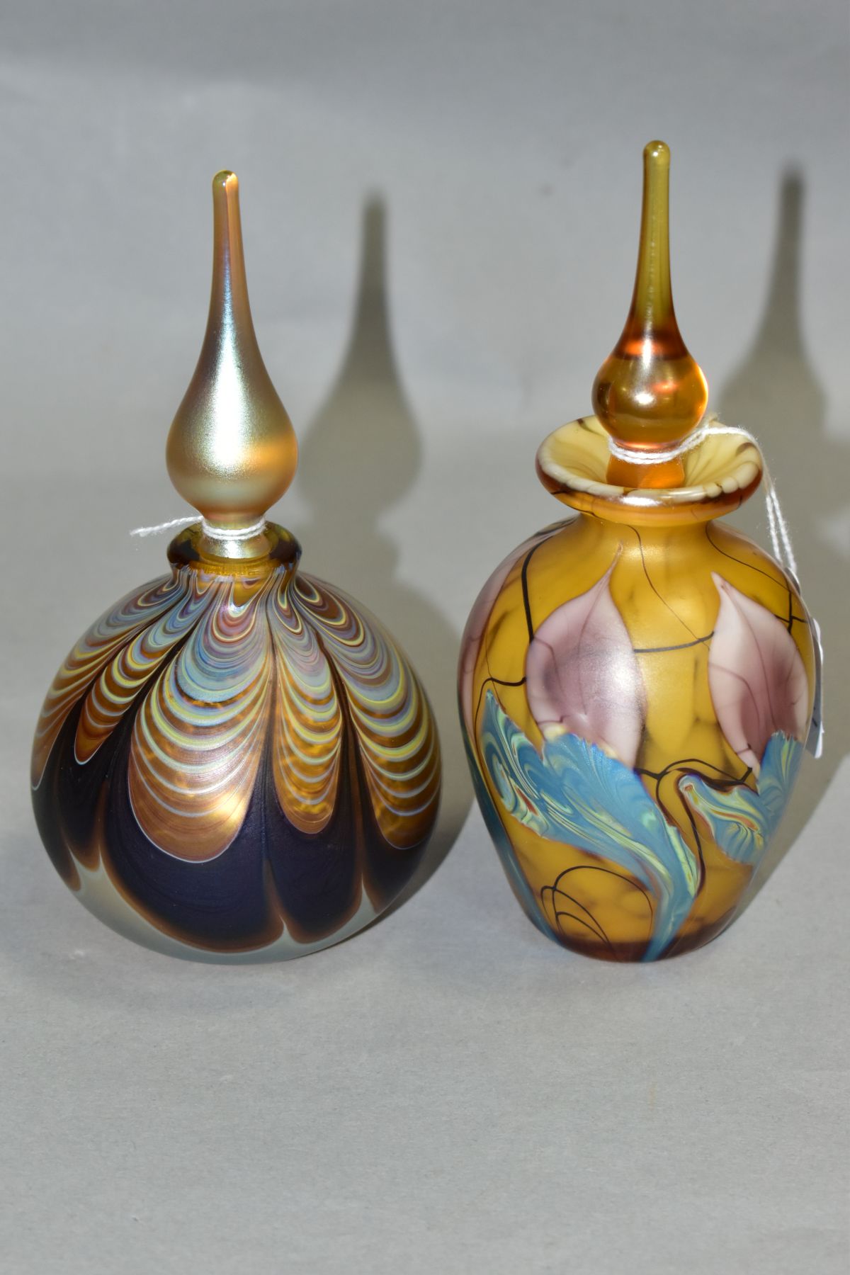 TWO IRIDESCENT PERFUME BOTTLES AND STOPPERS, one of baluster form, height 16cm, the other of bulbous - Image 2 of 5