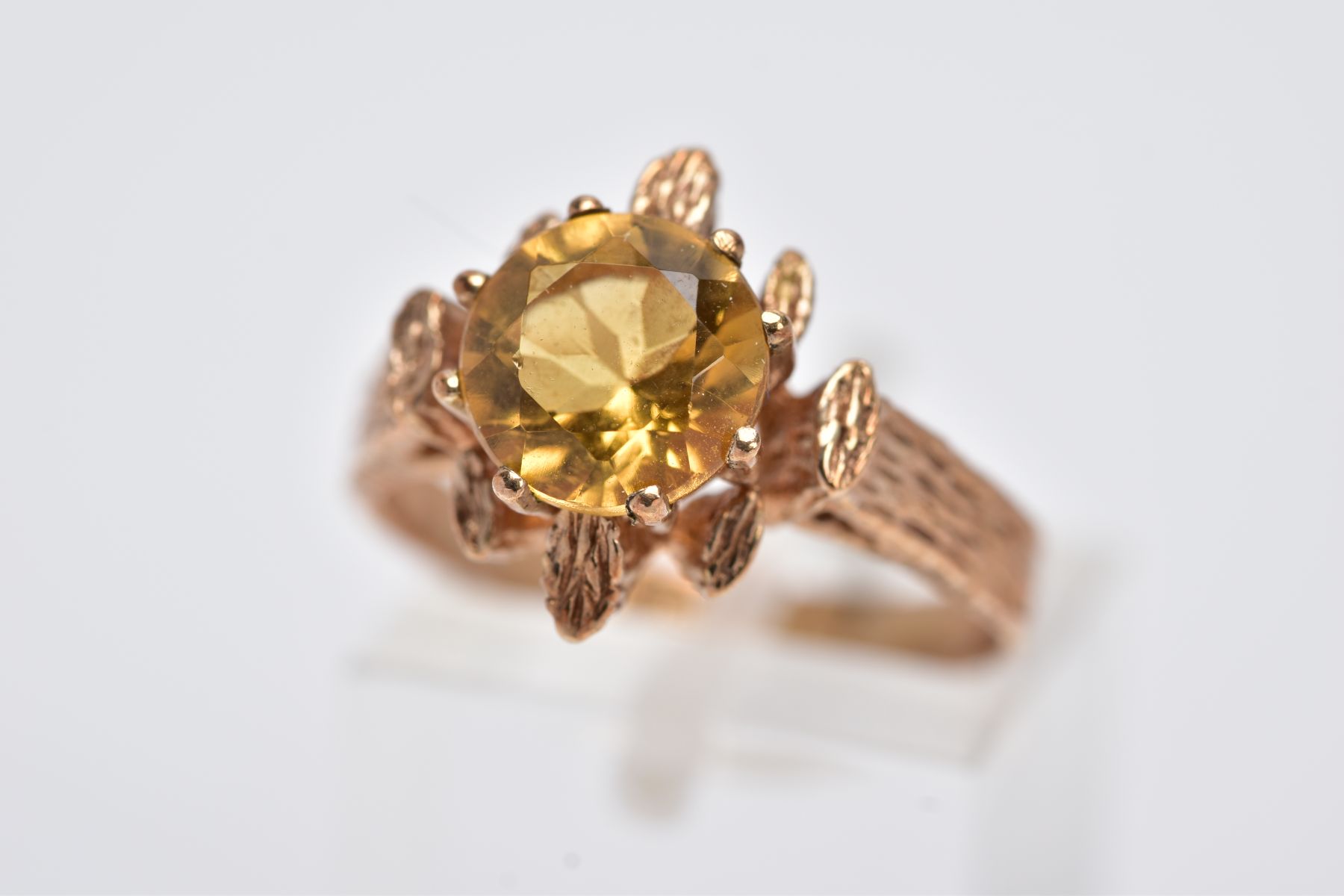 A 9CT GOLD SINGLE STONE CITRINE RING, a round mixed cut citrine measuring approximately 8.0mm in