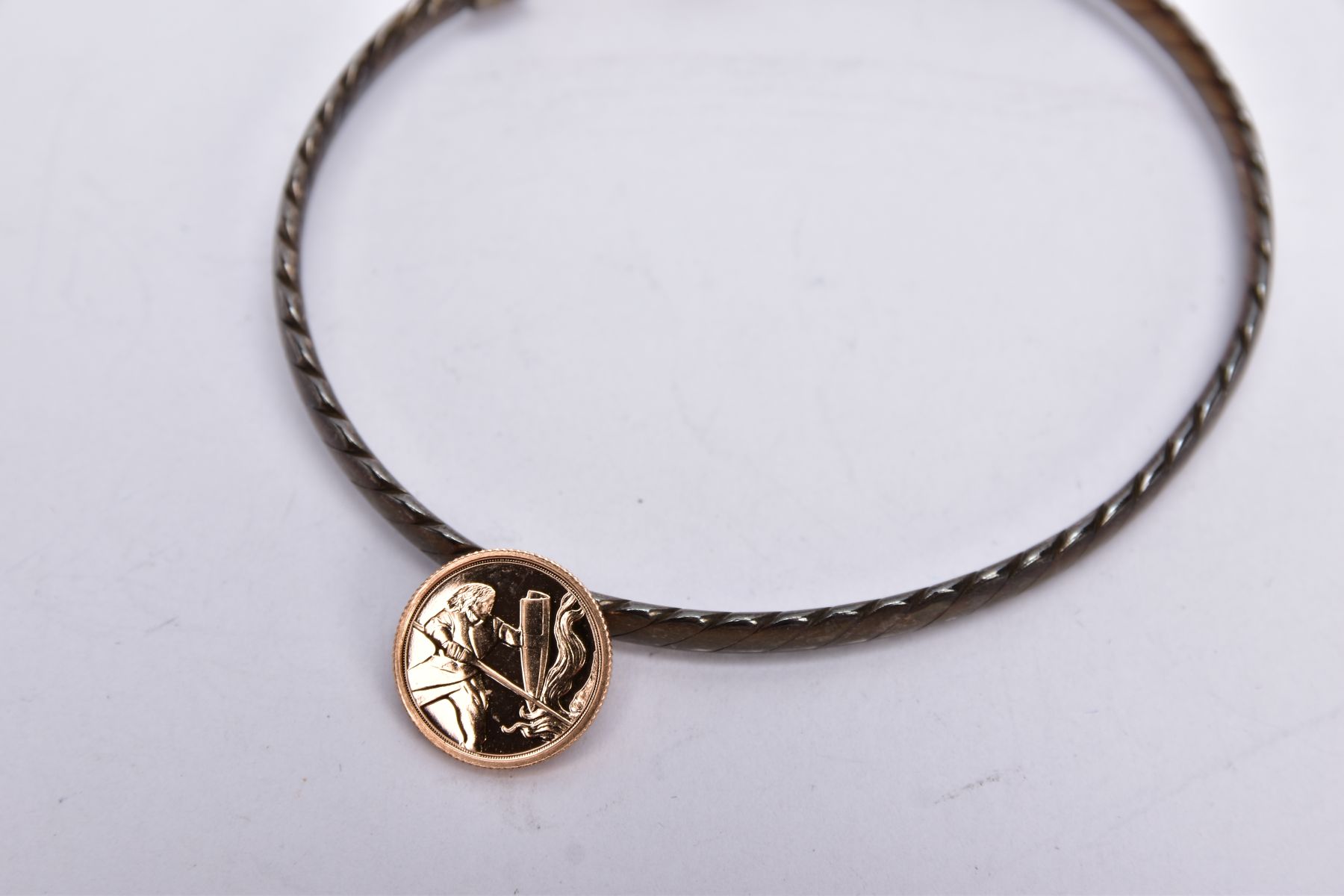 A SILVER AND 18CT GOLD BANGLE WITH A YELLOW METAL COIN, the silver bangle of a rope twist design - Image 2 of 3