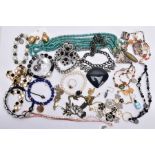 A BAG OF ASSORTED COSTUME JEWELLERY, to include a rose gold tone necklet set with cubic zirconia