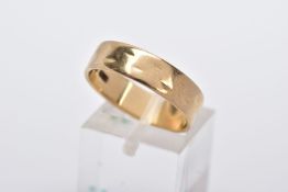 A 9CT GOLD WIDE BAND, slight textured effect, approximate width 5.5mm, hallmarked 9ct gold London,