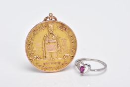 A 9CT GOLD MOUNTED MEDAL AND A 9CT WHITE GOLD RUBY AND DIAMOND RING, the medal of a circular form,