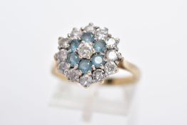 A 9CT GOLD DRESS RING, tiered cluster set with circular cut colourless stones assessed as paste,