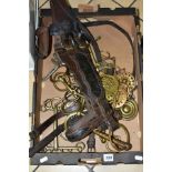 A BOX OF HEAVY HORSE TACK AND HORSE BRASSES, including a halter with brass bit attached and
