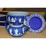 THREE PIECES OF WEDGWOOD BLUE JASPERWARE, comprising a pedestal fruit bowl, the applied decoration