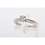 AN 18CT WHITE GOLD DIAMOND RING, designed with a central claw set, round brilliant cut diamond,