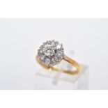 A LATE 20TH CENTURY ROUND DIAMOND CLUSTER RING, centring on a modern round brilliant cut diamond,