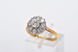 A LATE 20TH CENTURY ROUND DIAMOND CLUSTER RING, centring on a modern round brilliant cut diamond,