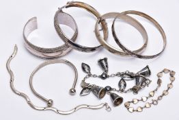 A BAG OF ASSORTED SILVER AND WHITE METAL BRACELETS, to include a silver hinged bangle with a