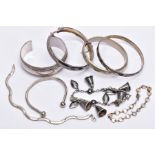 A BAG OF ASSORTED SILVER AND WHITE METAL BRACELETS, to include a silver hinged bangle with a