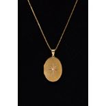 A LATE 20TH CENTURY 18CT DIAMOND SET LOCKET AND CHAIN, an oval plain polished locket set with a