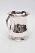 A SILVER TANKARD, bell shaped body with a feather detailed handle, hallmarked 'Roberts & Dore'