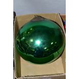A LATE 19TH/EARLY 20TH CENTURY METALLIC GREEN GLASS WITCH'S BALL with metal mount and short length