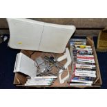 A BOX OF GAMING ITEMS, to include Wii console and Wii fit board and game, various other games (