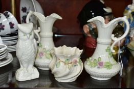 BELLEEK PORCLEAIN comprising a near pair of Aberdeen pitcher shaped vases, pink rose and shamrock