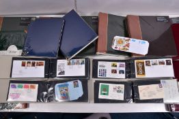 A BOX CONTAINING FOURTEEN ALBUMS viz, four cover albums with 1960's-80's first day covers from