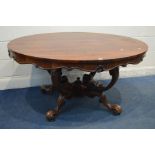 AN EARLY VICTORIAN ROSEWOOD OVAL TOP BREAKFAST TABLE, with a wavy apron, four scrolled supports