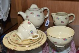A CLARICE CLIFF NEWPORT POTTERY PART TEA SET, transfer printed with floral sprays, Reg no 840076,