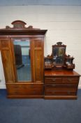 AN EDWARDIAN WALNUT WARDROBE, with a single mirror door above two short drawers over one long