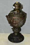 A LATE 19TH CENTURY BRONZED SPELTER OIL LAMP BASE, cast with Africans and Europeans to the base,