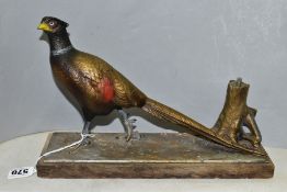 AN EARLY 20TH CENTURY PAINTED SPELTER TABLE LIGHTER IN THE FORM OF A COCK PHEASANT STANDING BY A