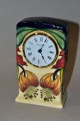 A MOORCROFT POTTERY TIMEPIECE, 'Anna Lily' pattern design by Nicola Slaney, impressed and painted