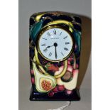 A MOORCROFT POTTERY TIMEPIECE, Queens Choice pattern designed by Emma Bossons, impressed and painted