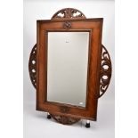 AN EARLY 20TH CENTURY ENGLISH OAK FRAMED MIRROR, circa 1920, with original bevelled edge plate,