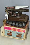 A BOXED S.T./T.P.S (TOKYO PLAYTHINGS) TINPLATE AND PLASTIC CLOCKWORK MECHANICAL MISSILE TANK,