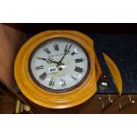 A ROSE & DICKENSON WOODEN CASED WALL CLOCK with pendulum and key, Roman numerals to the painted