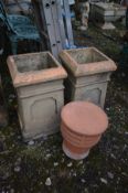 A PAIR OF SQUARE TERRACOTTA CHIMNEY POTS, 29cm squared x height 50cm and a chimney topper (3)