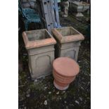 A PAIR OF SQUARE TERRACOTTA CHIMNEY POTS, 29cm squared x height 50cm and a chimney topper (3)