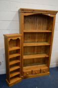 A MODERN PINE OPEN BOOKCASE with three fixed shelves above three small drawers, width 91cm x depth
