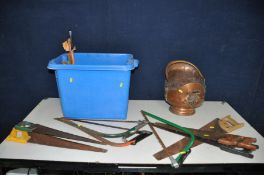 A PLASTIC TUB CONTAINING saws, hammers, screwdrivers and a copper coal scuttle
