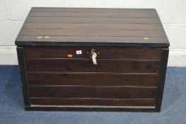 A STAINED PINE STORAGE BOX with twin drop handles, painted interior and an internal tray, width 94cm