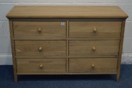 A NATURAL OAK SIDEBOARD/CHEST OF SIX DRAWERS, width 127cm x depth 47cm x height 82cm