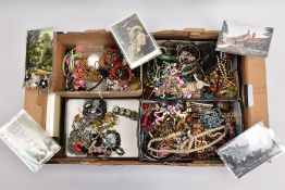 A LARGE BOX OF MIXED COSTUME JEWELLERY, including bangles, rings, beaded necklaces, five postcards