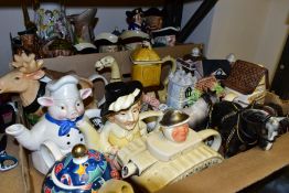 TWO TRAYS OF NOVELTY TEAPOTS AND CHARACTER JUGS ETC, to include a sadler style Winston Churchill and