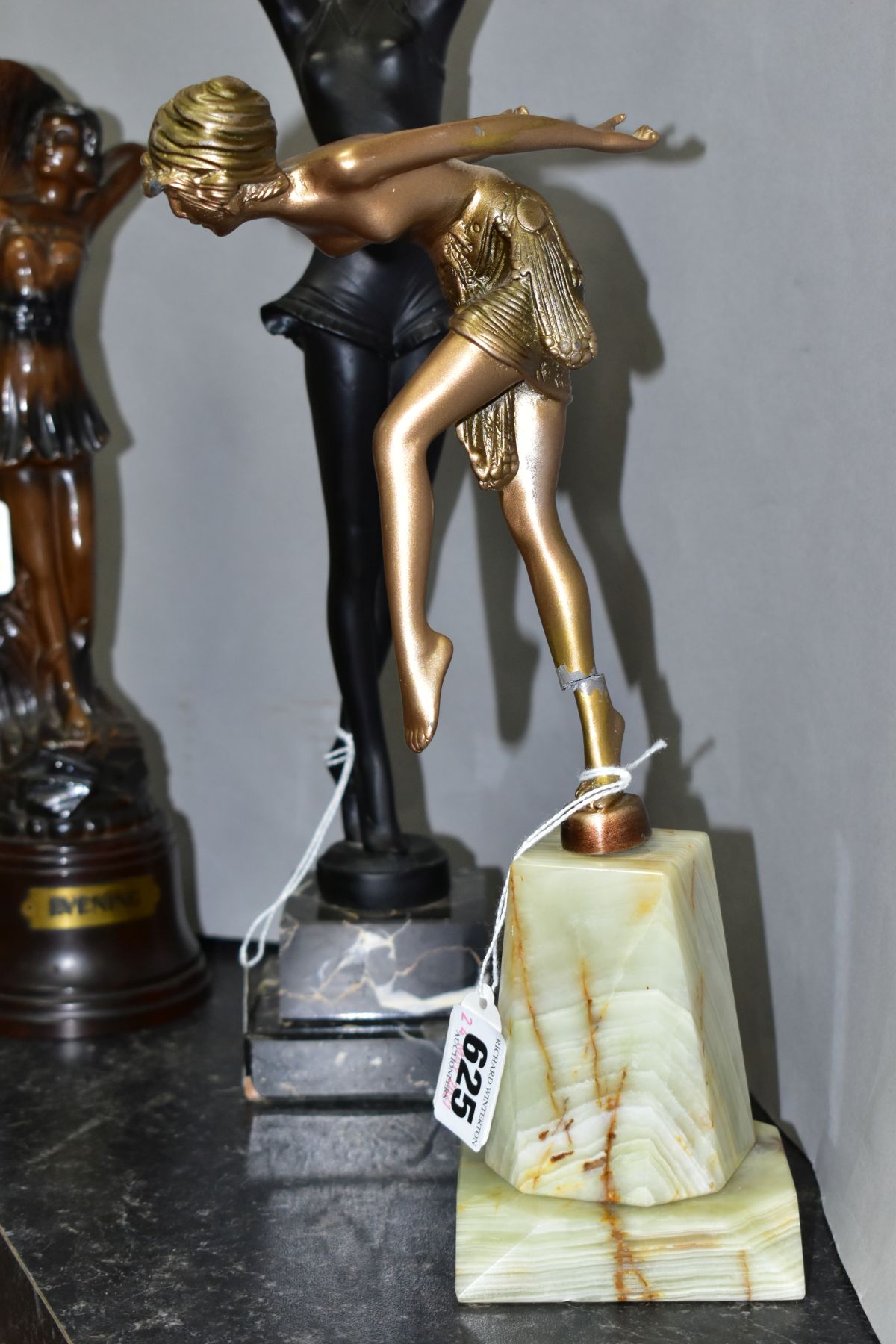 ART DECO STYLE FIGURINES, comprising a bronzed metal scantilly clad female on an onyx plinth, - Image 6 of 11