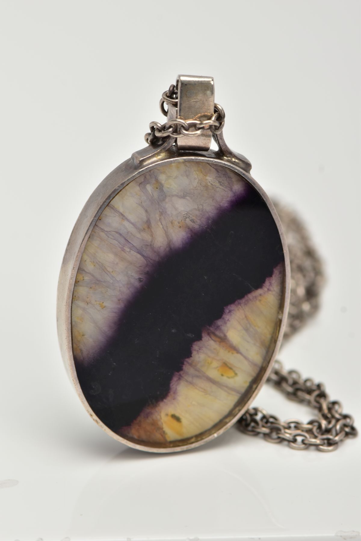 A SILVER PENDANT NECKLACE, the pendant of an oval form, one side set with blue john fluroite, the - Image 2 of 4
