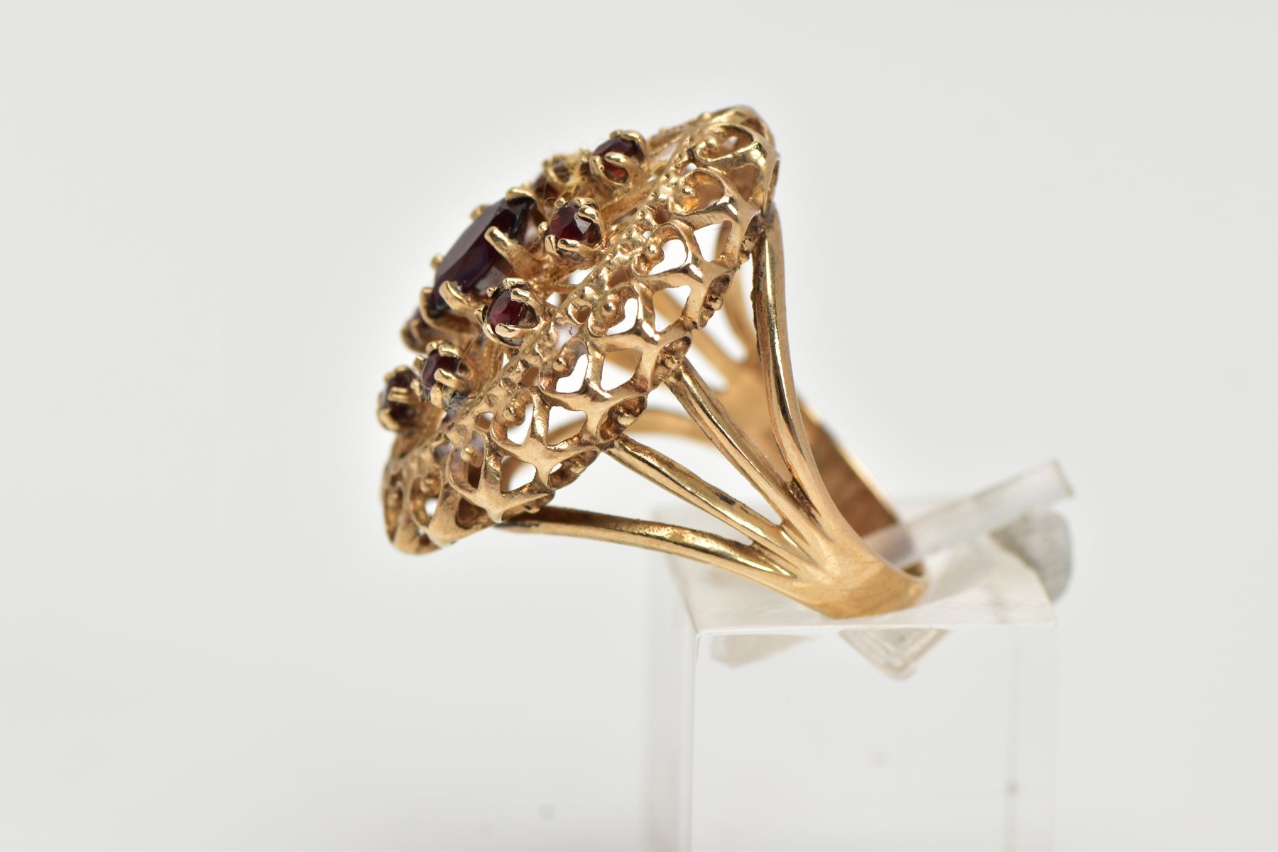 A 9CT GOLD GARNET RING, of an openwork lozenge form, set with a central oval cut garnet and circular - Image 2 of 4